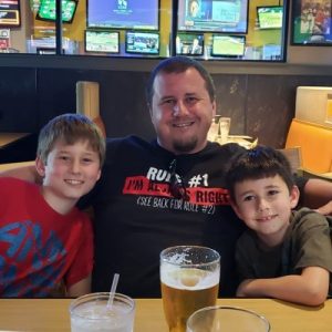 About Me 1 Mike Enjoying Bbq With Sons